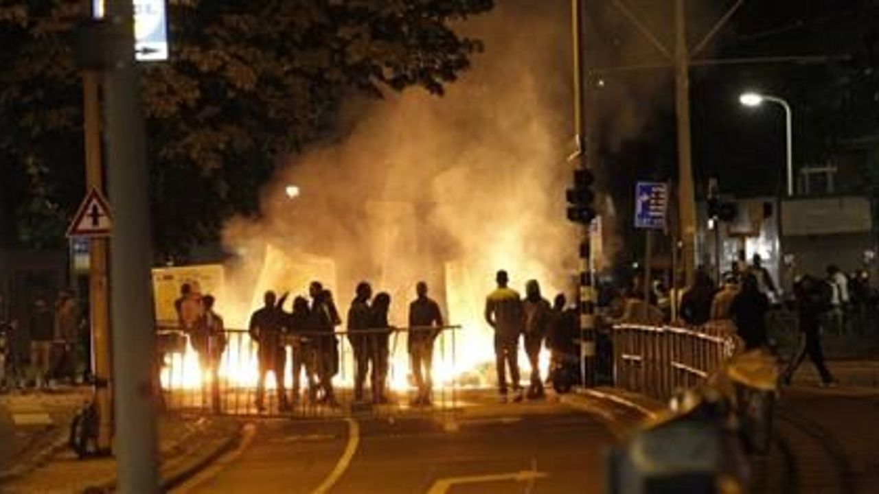 Holland bans gatherings after protests over police violence