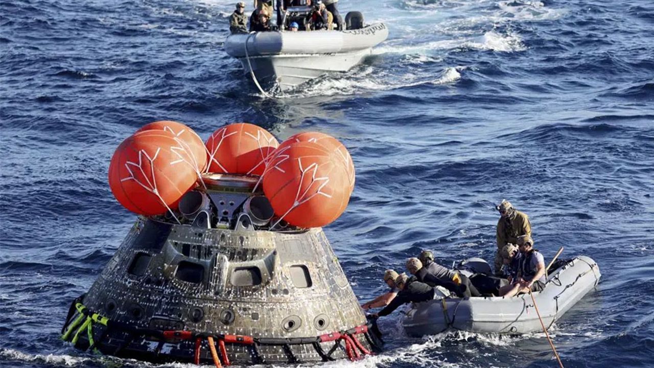 NASA Orion capsule safely blazes back from moon, aces test