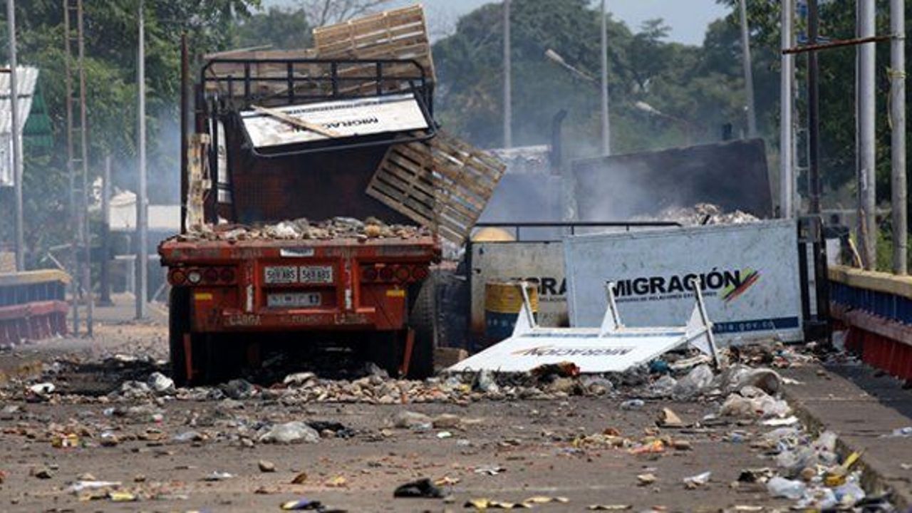 Venezuela denies claims of setting fire to aid trucks