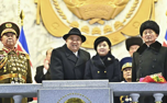 Korean leader Kim Jong Un shows off his daughter and new missiles